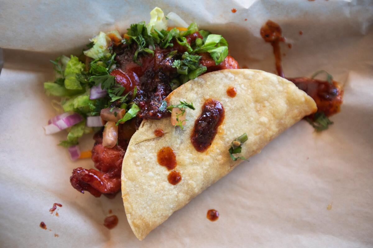 Worldwide Tacos offers unusual fillings, such as this raspberry shrimp taco, made fresh by owner Fredrick Sennie.