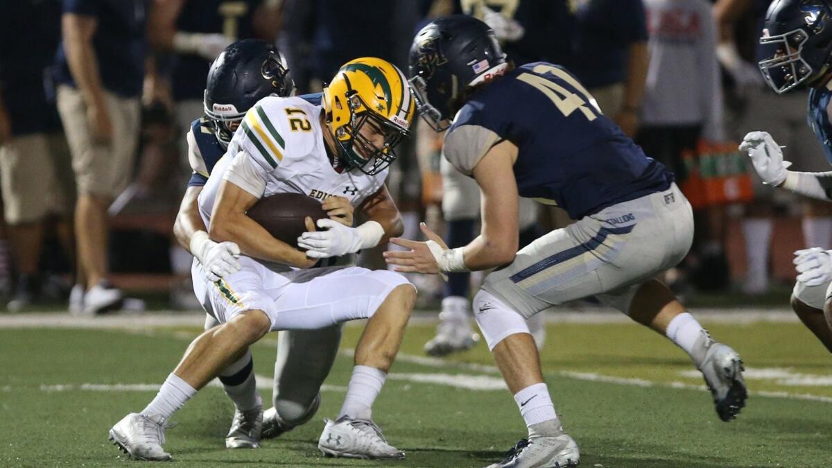 Edison High quarterback Patrick Angelovic is sacked by San Juan Hills in the first half on Friday. Angelovic left the game in the fourth quarter with an apparent shoulder injury.