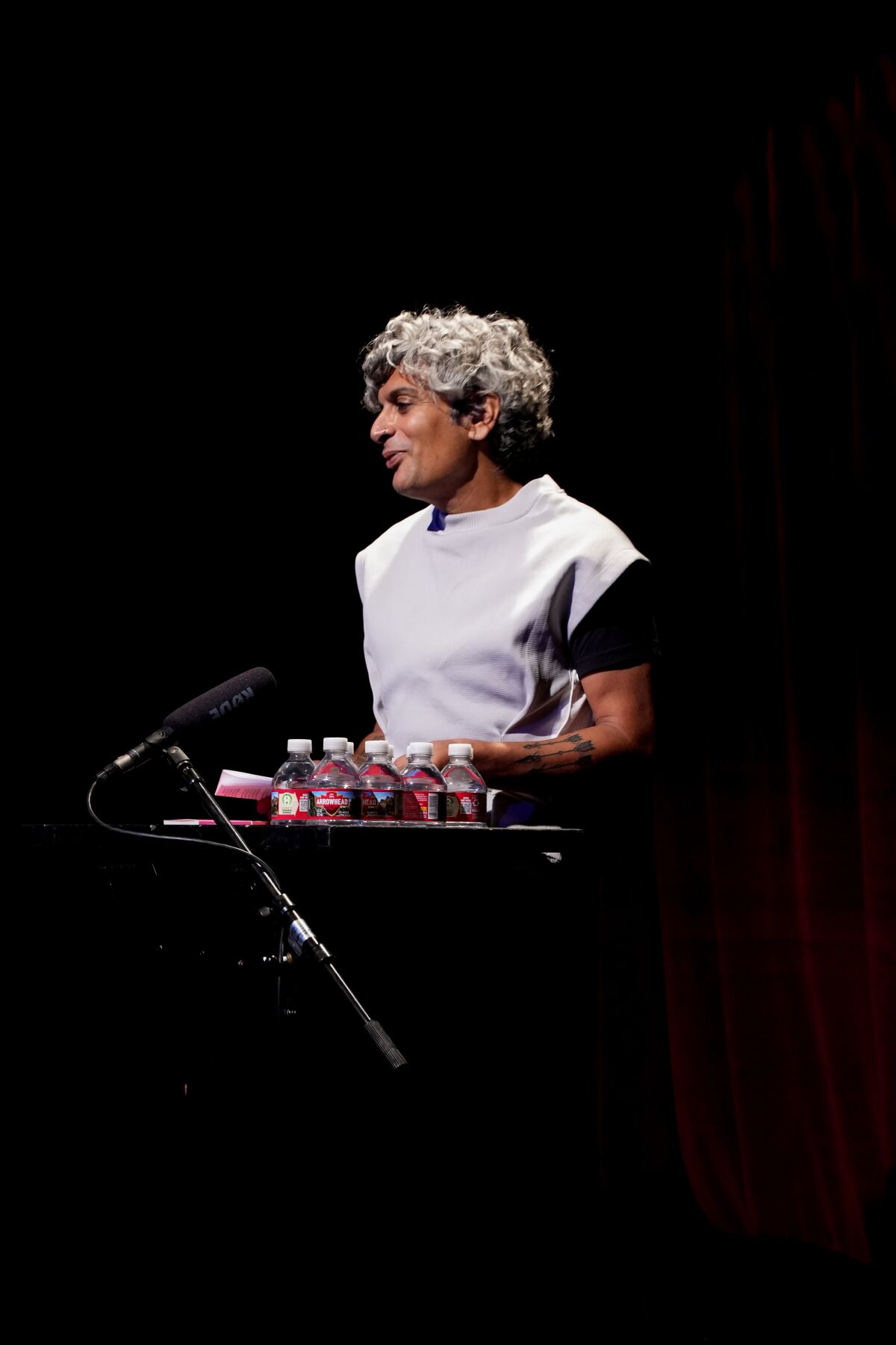 A man stands onstage.