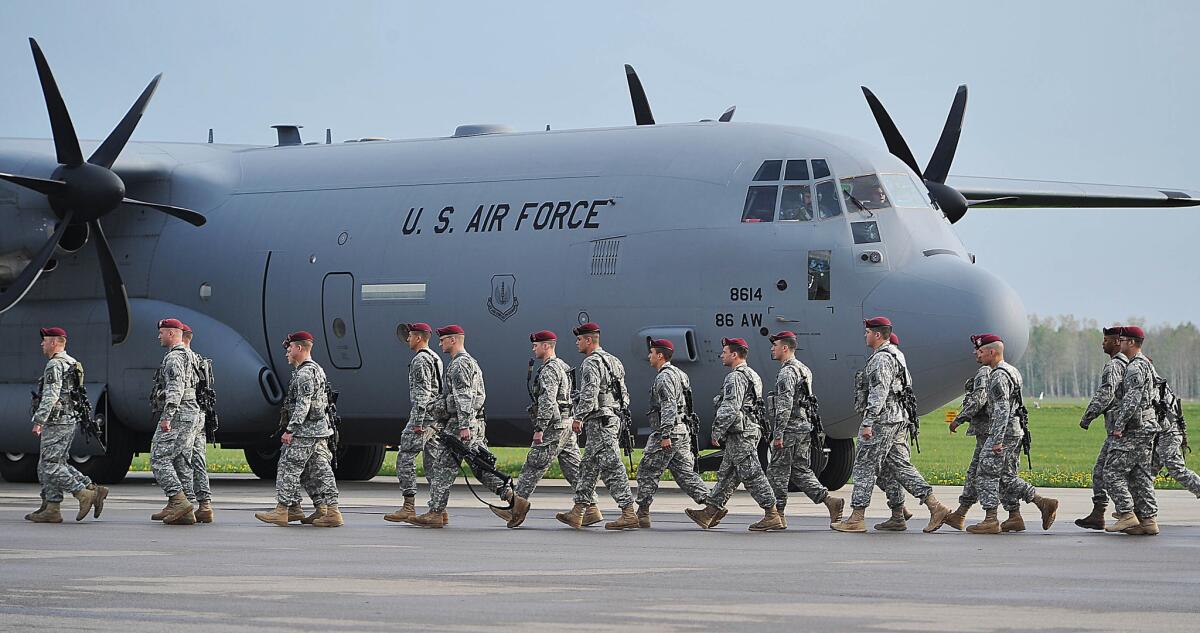 The Pentagon has sent U.S. paratroopers to Poland in response to Russian aggression in neighboring Ukraine, as seen in this photo taken at the air base in Swidwin last week. A poll released Monday shows Americans oppose military help for Ukraine by a 2-1 margin.