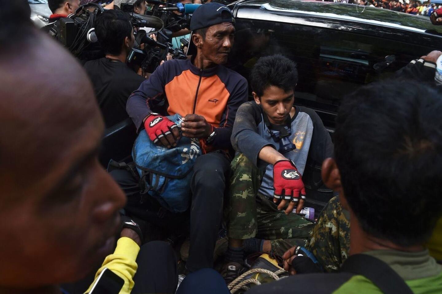 Volunteers prepare Friday to search for alternative entry points to a Thailand cave area as a rescue operation continues for 12 trapped boys and their soccer coach.