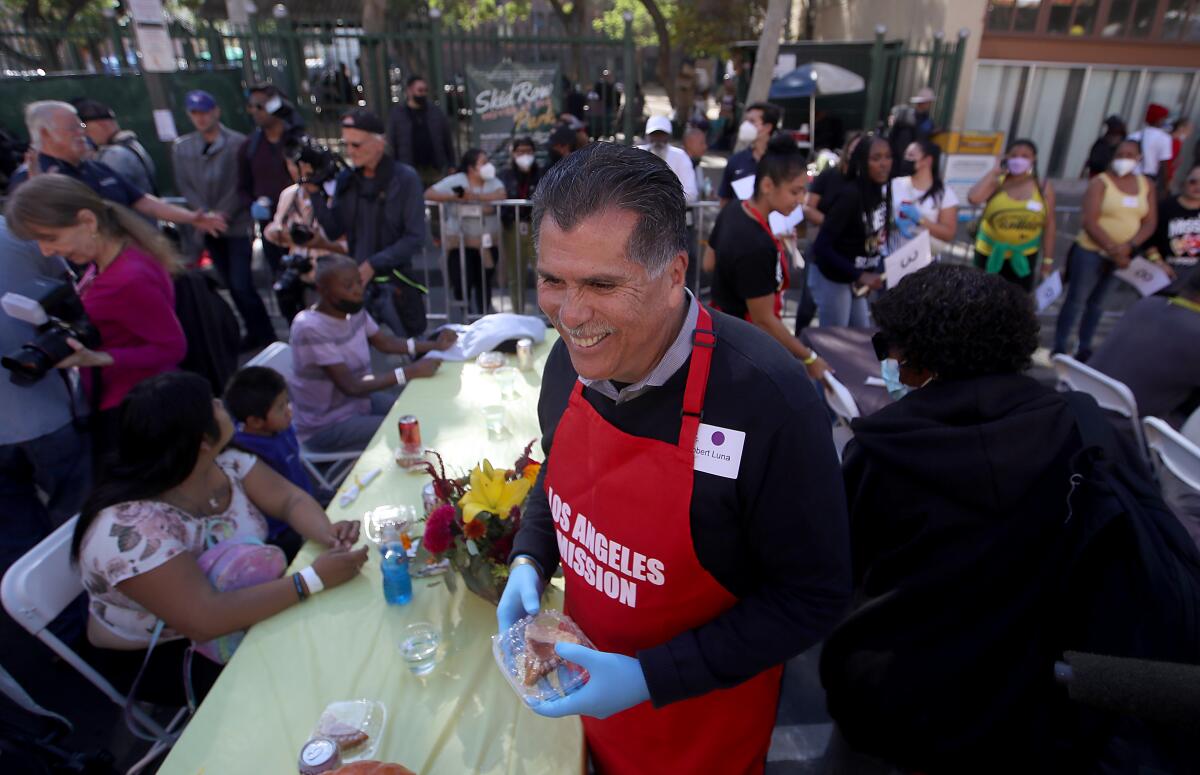 Los Angeles County Sheriff-elect Robert Luna serves Thanksgiving meals at Los Angeles Mission.