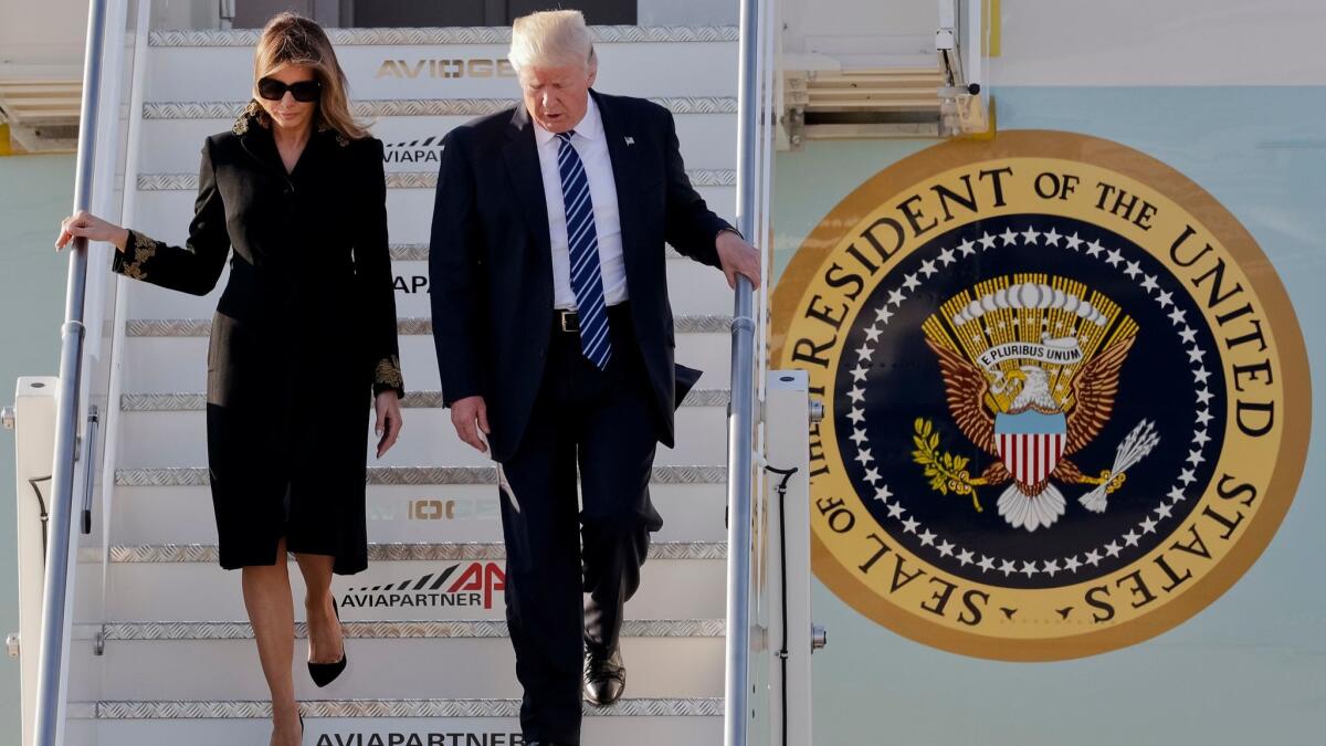 President Trump and his wife, Melania, arrive at Leonardo Da Vinci International Airport near Rome on May 23, 2017.