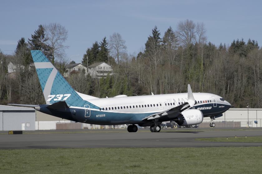 FILE - A Boeing 737 MAX 7 takes off on its first flight on March 16, 2018, in Renton, Wash. Facing severe criticism after a door plug blew out on a 737 Max over Oregon this month, Boeing said Monday, Jan. 29, 2024, that it is withdrawing a request for a safety exemption needed to certify the new model of the plane. (AP Photo/Jason Redmond, File)