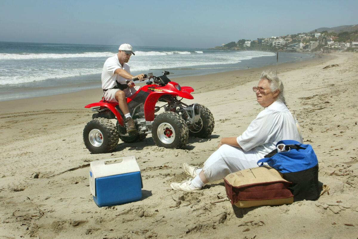 Sara Wan on Broadbeach confronted immediately by a security guard on an ATV