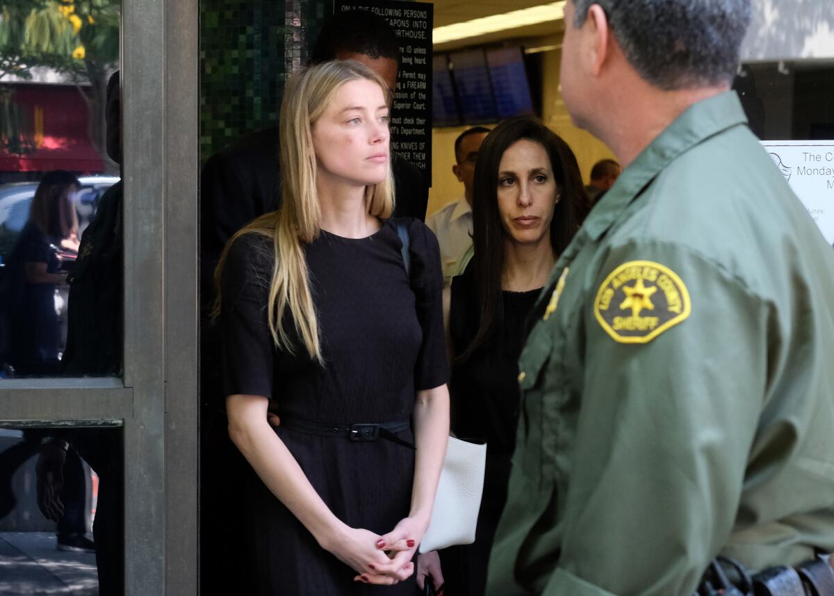 Actress Amber Heard leaves Los Angeles Superior Court court on May 27 after giving a sworn declaration that her husband Johnny Depp threw her cellphone at her during a fight, striking her cheek and eye.