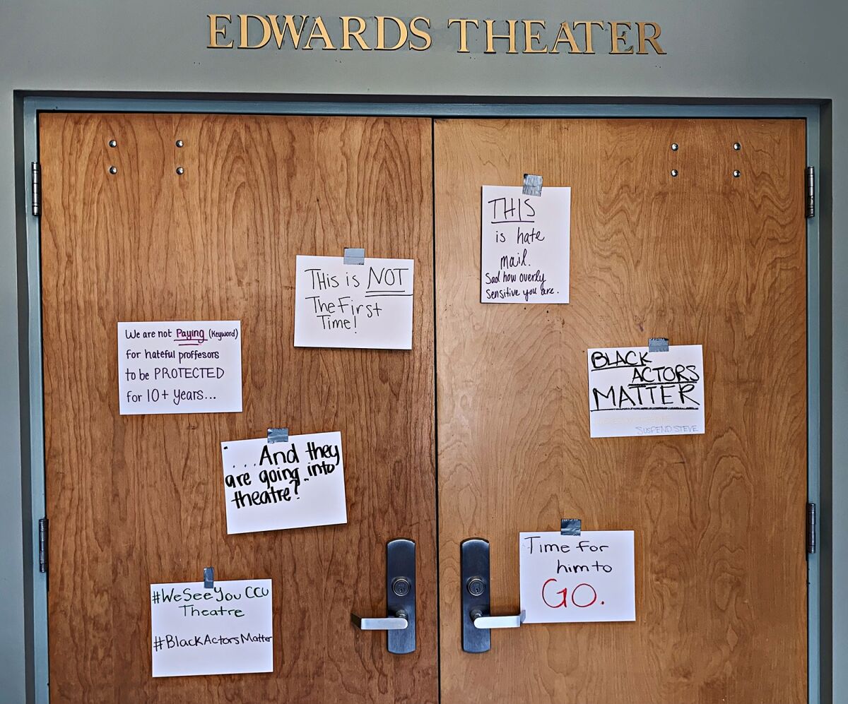 Messages are pinned on a theater door at Coastal Carolina University.
