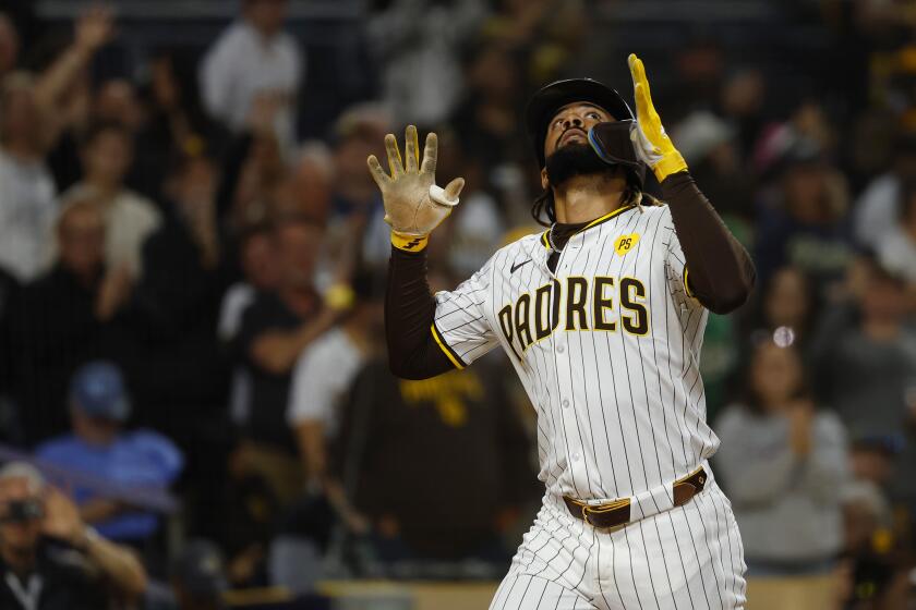 Padres' Fernando Tatis Jr. crosses plate after hitting a home run against the A's.