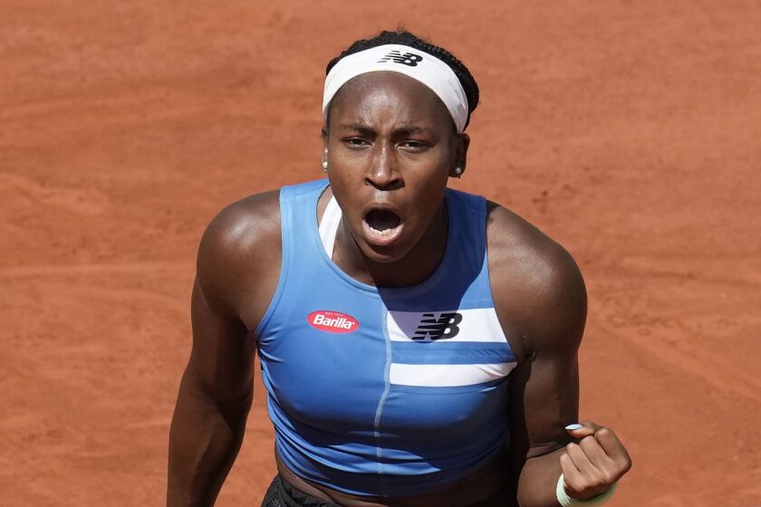 Coco Gauff of the U.S. celebrates winning her third round match of the French Open tennis tournament against Russia's Mirra Andreeva at the Roland Garros stadium in Paris, Saturday, June 3, 2023. (AP Photo/Christophe Ena)