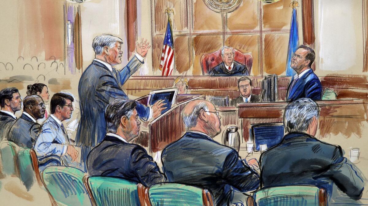 Defense lawyer Kevin Downing is shown asking questions of Richard Gates during former Trump campaign chairman Paul Manafort's trial in Alexandria, Va.
