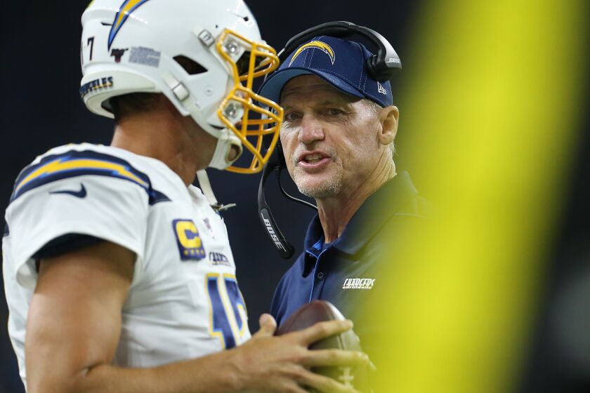 DETROIT, MI - SEPTEMBER 15: Los Angeles Chargers offense of coordinator Ken Whisenhunt talks to Philip Rivers #17 of the Los Angeles Chargers on the sidelines during a game against the Detroit Lions at Ford Field on September 15, 2019 in Detroit, Michigan. (Photo by Rey Del Rio/Getty Images)