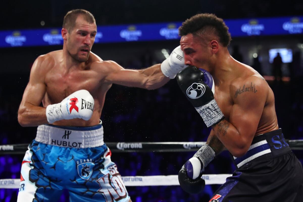 Sergey Kovalev lands a left to the head of Andre Ward during their light-heavyweight title bout on Nov. 19, 2016.