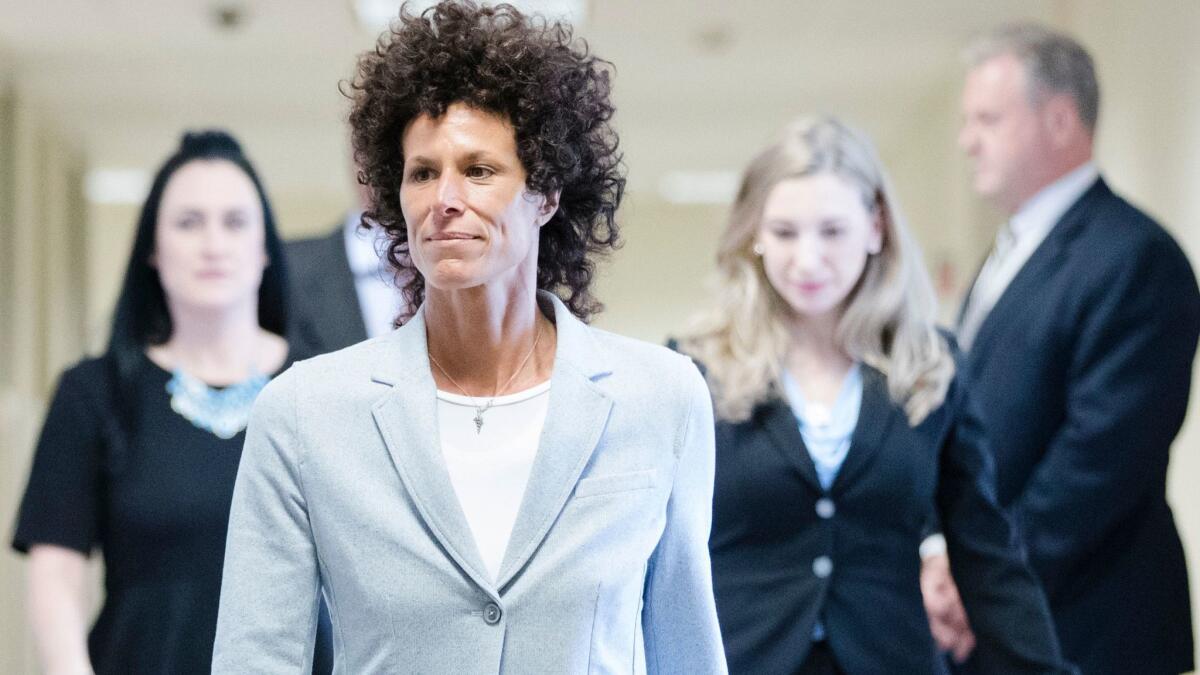 Andrea Constand walks to the courtroom Tuesday during Bill Cosby's sexual assault trial at the Montgomery County Courthouse in Norristown, Pa.