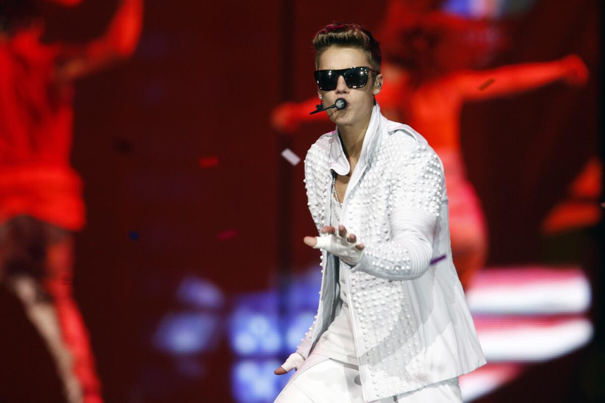 Justin Bieber won't face criminal charges for a scrape with a photographer outside a Sunset Strip comedy club in June. Above, Bieber performing this month in Buffalo, N.Y.