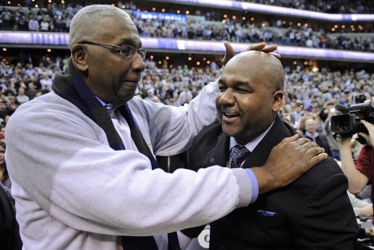 Former Georgetown coach John Thompson Jr. congratulates Georgetown coach John Thompson III after a Hoyas win March 9, 2013.