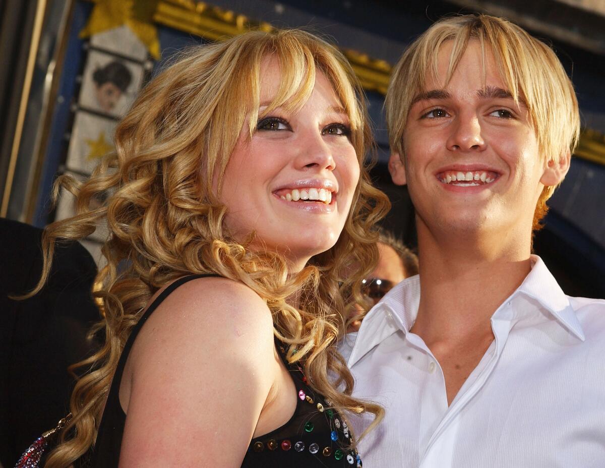 Hilary Duff and Aaron Carter attend the premiere of "The Lizzie McGuire Movie."