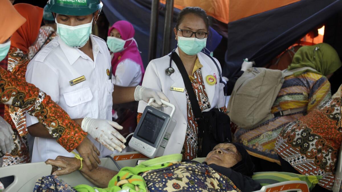 A woman injured in an earthquake is treated in Mataram, Lombok, Indonesia, on Thursday.