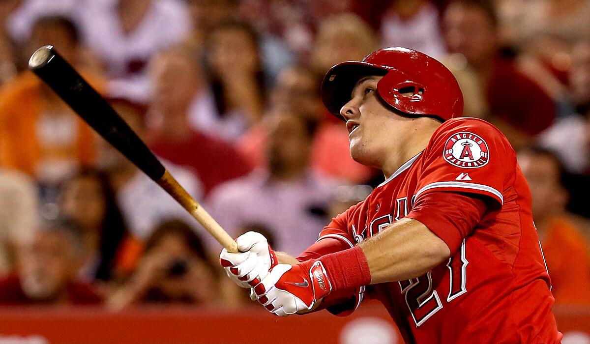 Mike Trout watches the trajectory of his two-run homer against the Baltimore Orioles during a game July 22 at Angel Stadium.