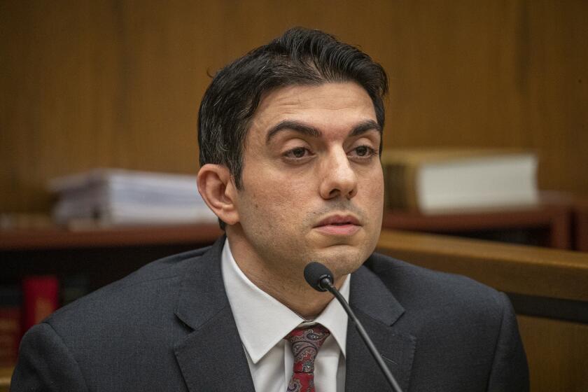 NEWPORT BEACH, CA - AUGUST 01, 2019 Ñ Hossein Nayeri takes the stand in his trial in a Newport Beach courthouse. Nayeri is accused of participating in a 2012 plot to abduct a marijuana dispensary owner who was taken to the Mojave desert, tortured and sexually mutilated. Prosecutors say the crime was motivated by the mistaken belief that the victim had hidden $1 million in the desert. (Irfan Khan/Los Angeles Times)