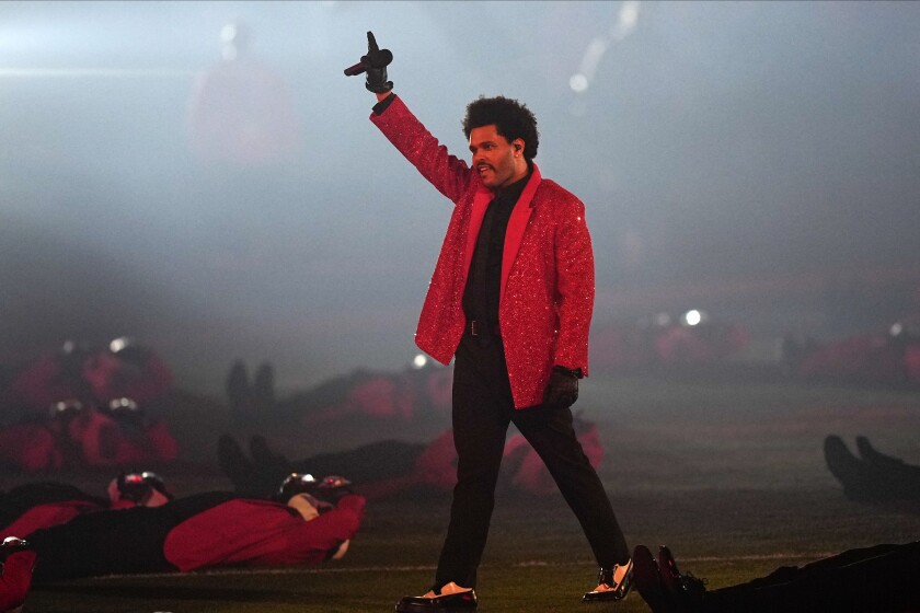 The Weeknd performs during halftime of the NFL Super Bowl 55 football game between during the halftime show of the NFL Super Bowl 55 football game between the Kansas City Chiefs and Tampa Bay Buccaneers, Sunday, Feb. 7, 2021, in Tampa, Fla. (AP Photo/David J. Phillip)