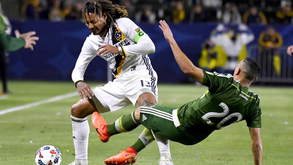 Veteran midfielder Jermaine Jones (13), battilng Timbers midfielder David Guzman for the ball during an exhibition game last month, is a newcomer to the Galaxy.