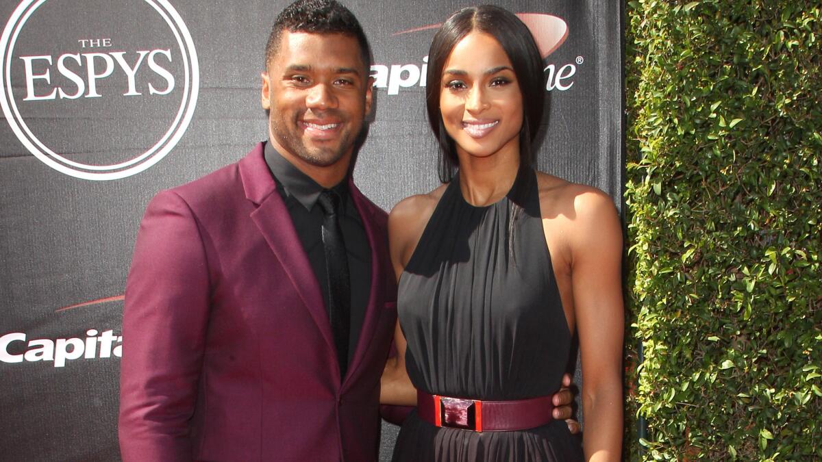 NFL quarterback Russell Wilson and singer Ciara walk the ESPY Awards red carpet together on July 15 in downtown Los Angeles.