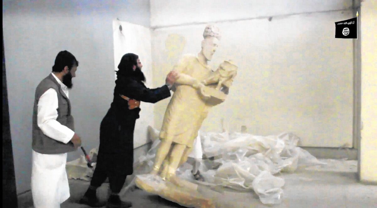 A five-minute video released on the Internet purports to show Islamic State militants breaking ancient artworks inside the Mosul Museum in Iraq.