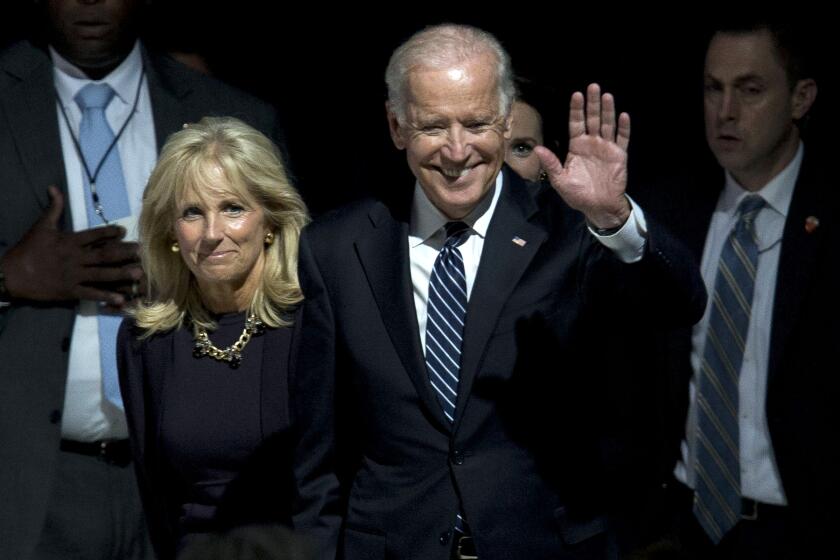 Vice President Joe Biden and his wife, Jill Biden wave to volunteers from the World Meeting of Families at Philadelphia International Airport in Philadelphia, Sunday, Sept. 27, 2015, before saying goodbye to Pope Francis. Pope Francis wrapped up his 10-day trip to Cuba and the United States on Sunday. (AP Photo/Laurence Kesterson)