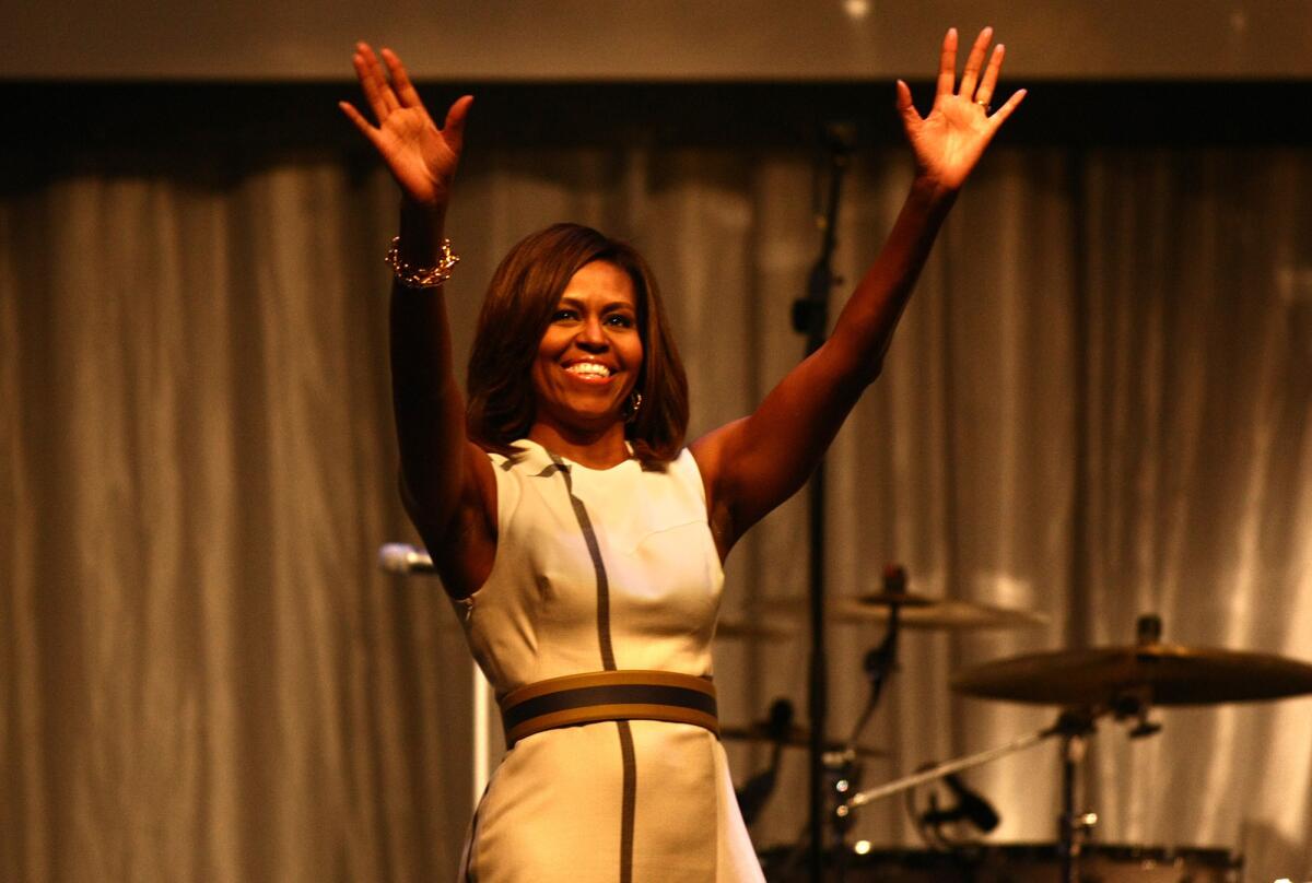 First Lady Michelle Obama arrives at the Grammy Museum-sponsored Jane Ortner Education Award Luncheon at Club Nokia on Wednesday to give the keynote speech.