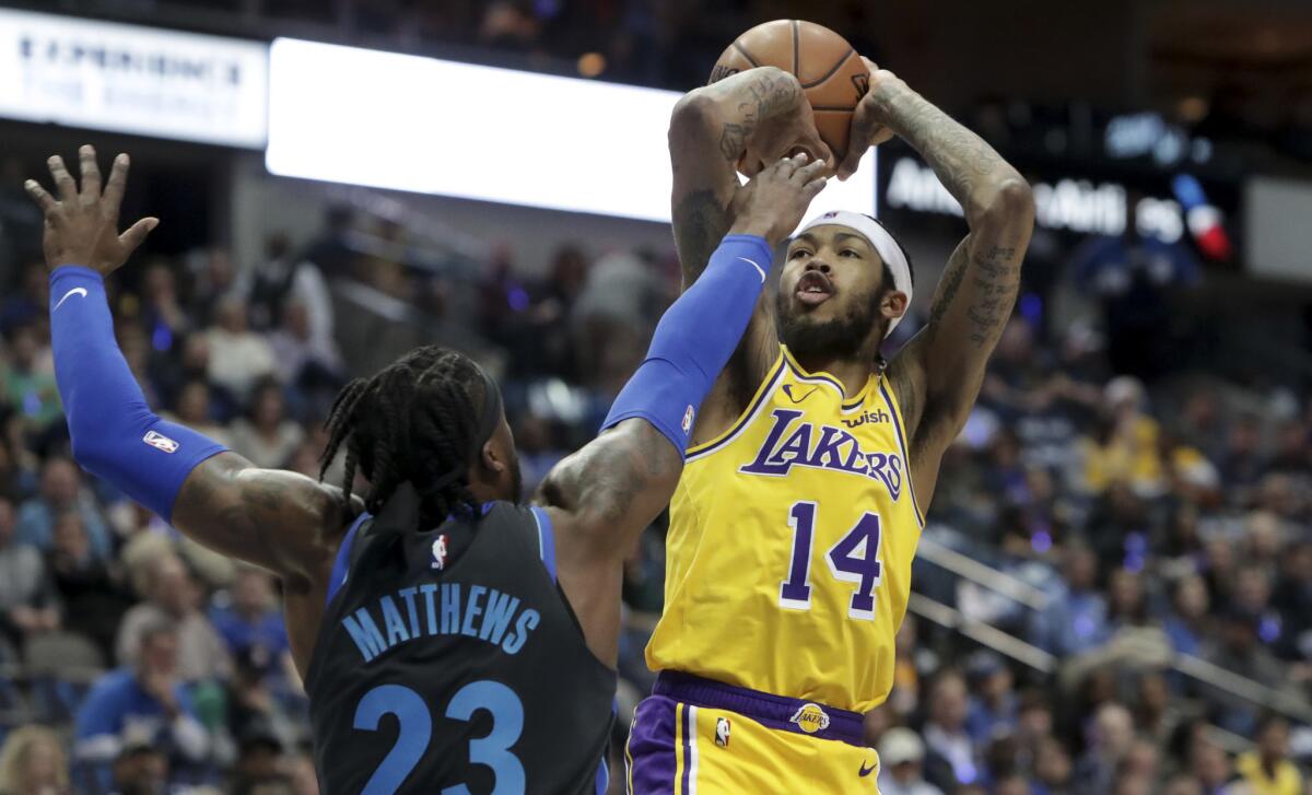 Lakers forward Brandon Ingram shoots against Dallas guard Wesley Matthews during a game Jan. 7 in Dallas.