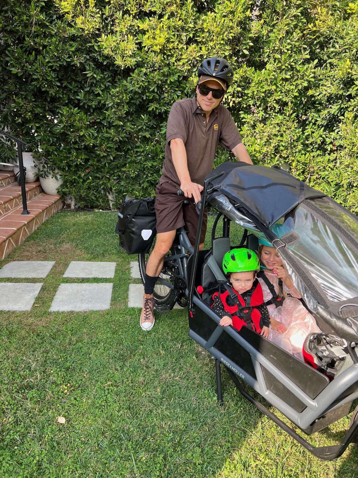 Michael Schneider dressed up for a Halloween party with his children on his bike. 