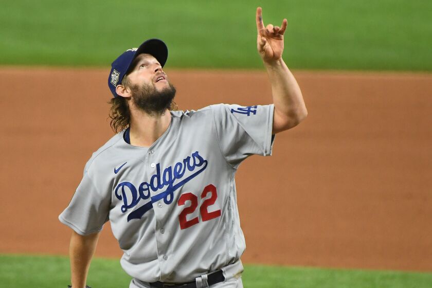 ARLINGTON, TEXAS OCTOBER 25, 2020-Dodgers pitcher Clayton Kershaw points to the sky as a Rays hitter pops-up in the 6th inning in Game 5 of the World Series at Globe Life Field in Arlington, Texas Sunday. (Wally Skalij/Los Angeles Times)