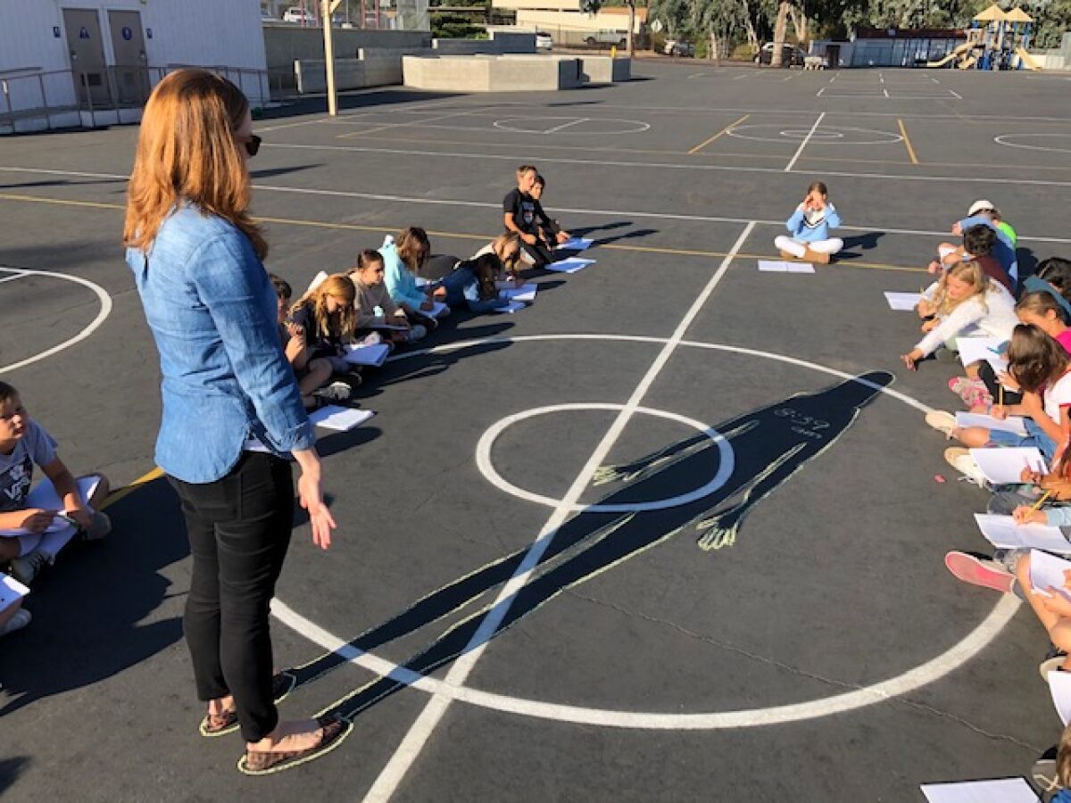 Rowe students investigate shadows as part of a science exploration.