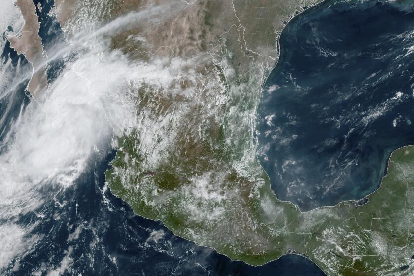 This satellite image taken at 12:40 pm ET on Sept. 13, 2024, provided by the National Oceanic and Atmospheric Administration, shows Tropical Storm Ileana at Mexico's southern tip of the Baja California peninsula. (NOAA via AP)