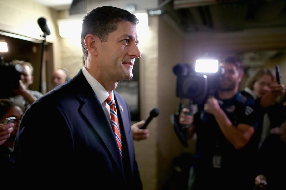 House Ways and Means Committee Chairman Paul Ryan (R-Wis.) heads for House Republican caucus meeting in the basement of the Capitol in Washington on Oct. 9, 2015.
