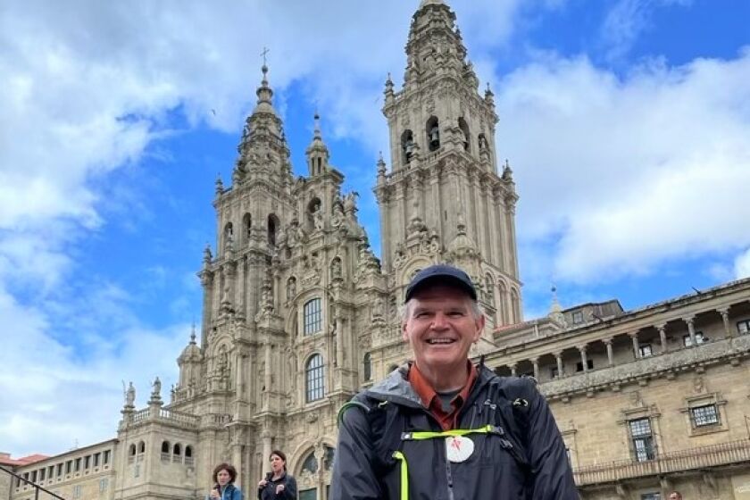 University of San Diego President James T. Harris III reaches the Spanish cathedral at the end of the Camino de Santiago.
