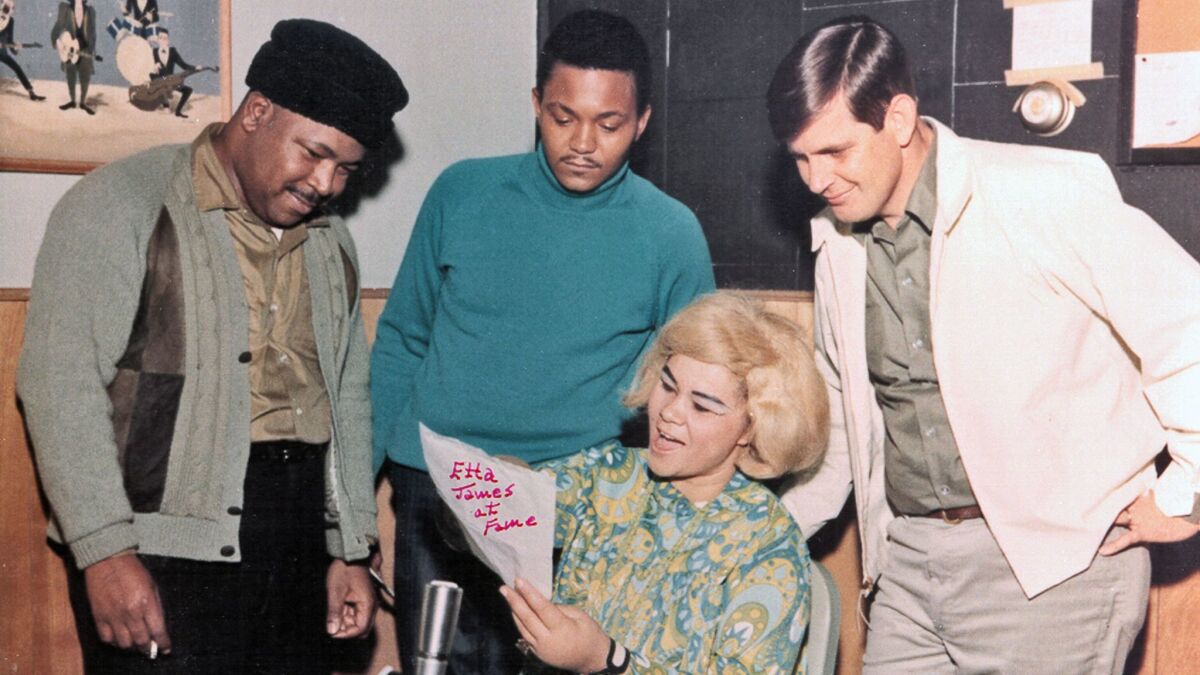 R&B singer Etta James rehearses as Fame Studios owner Rick Hall, right, and members of the house band look on during a recording session circa 1967 in Muscle Shoals, Ala.