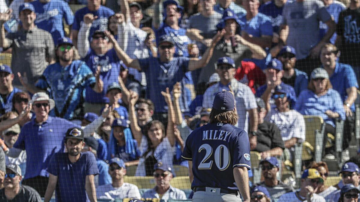 Brewers pitcher Wade Miley leaves the game after five pitches in the first inning.