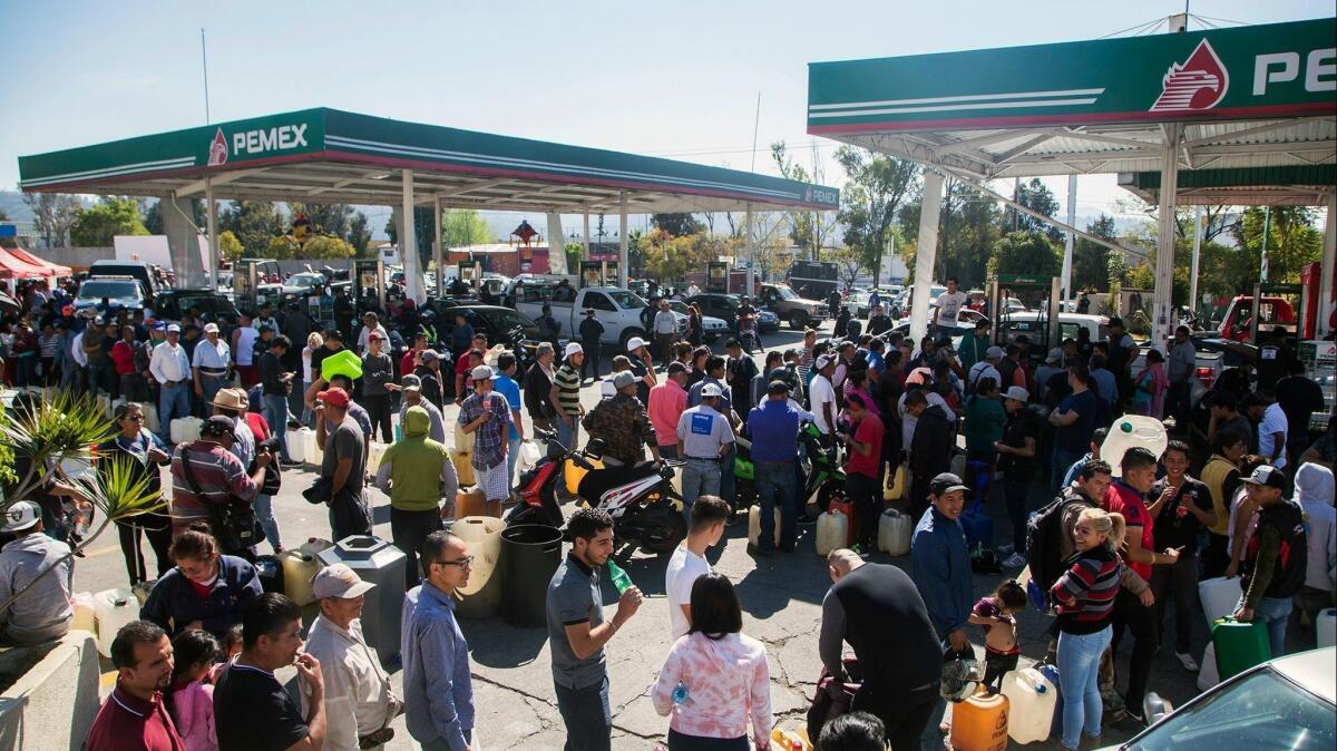 Customers line up at a gas station in Morelia, in Mexico's Michoacan state, on Jan. 9, 2019.