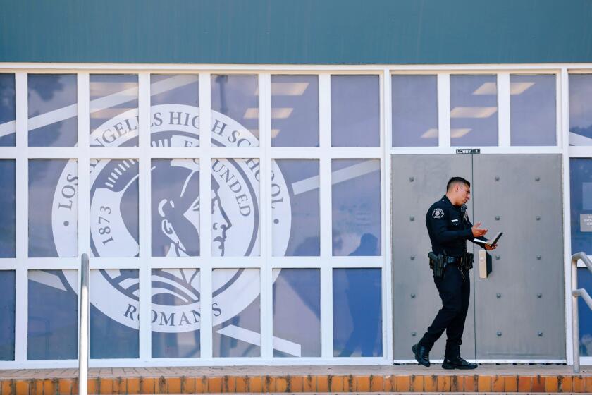 Los Angeles, CA - May 02: An officer is seen outside Los Angeles High School where two people were stabbed yesterday and three arrested today in connection on Tuesday, May 2, 2023 in Los Angeles, CA. (Dania Maxwell / Los Angeles Times).