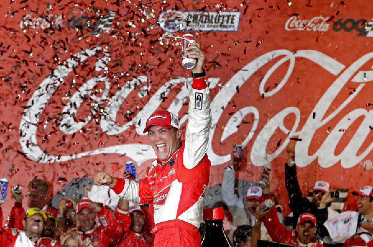 Kevin Harvick celebrates in victory lane after winning the NASCAR Sprint Cup series Coca-Cola 600.