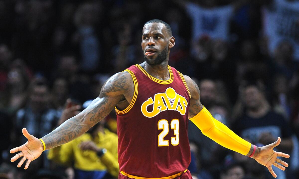 Cavaliers forward LeBron James celebrates a basket during a game against the Clippers.