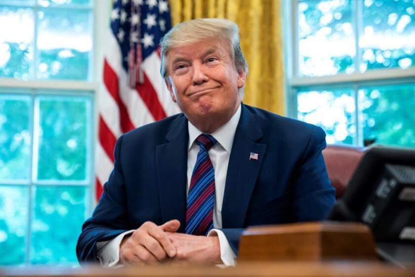 US President Donald J. Trump speaks to the media after reaching an asylum deal with Guatemala in the Oval Office of the White House in Washington, DC, USA, 26 July 2019. EFE/EPA/JIM LO SCALZO