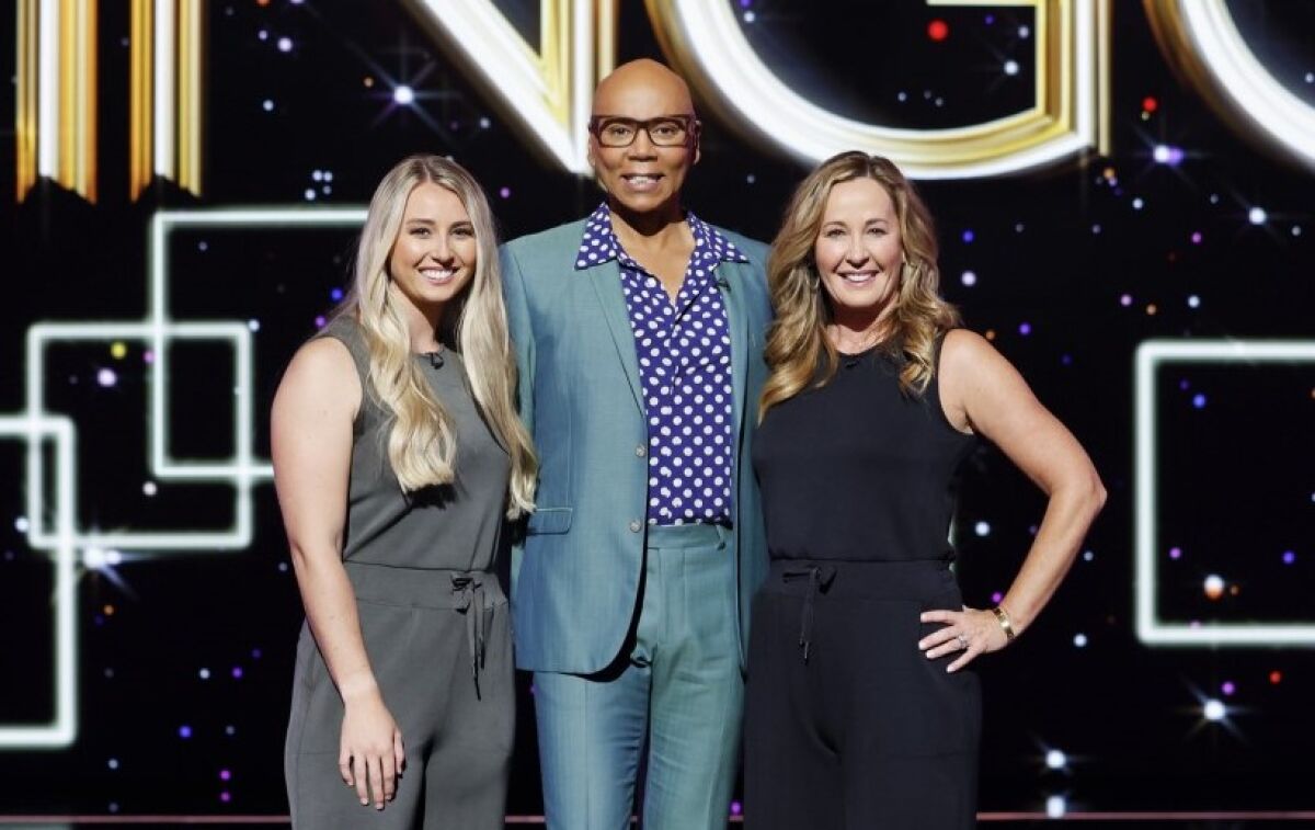 "Lingo" host RuPaul Andre Charles, with Riley Compton and her mother, Annmarie Tejcek, on the game show's March 8 episode.
