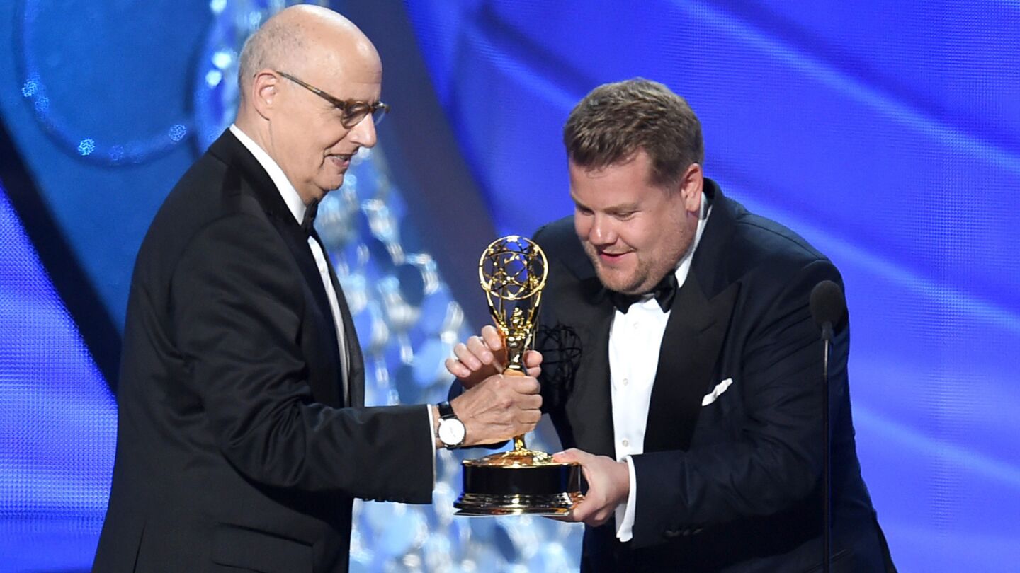 "Transparent" actor Jeffrey Tambor, left, accepts the award for lead actor in a comedy series from TV personality James Corden.