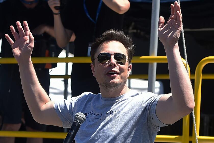 (FILES) In this file photo taken on July 22, 2018 SpaceX, Tesla and The Boring Company founder Elon Musk speaks at the 2018 SpaceX Hyperloop Pod Competition, in Hawthorne, California. Tesla chief executive Elon Musk said August 7, 2018 he would remain CEO of the electric automaker even if it ceases to be publicly traded. Trading in the company's shares were suspended mid-afternoon following Musk's suggestion that it could go private. Before that, they had surged by more than seven percent."No change," Musk replied to a Twitter user who asked whether he would like to stay on in his current position. / AFP PHOTO / Robyn BeckROBYN BECK/AFP/Getty Images ** OUTS - ELSENT, FPG, CM - OUTS * NM, PH, VA if sourced by CT, LA or MoD **