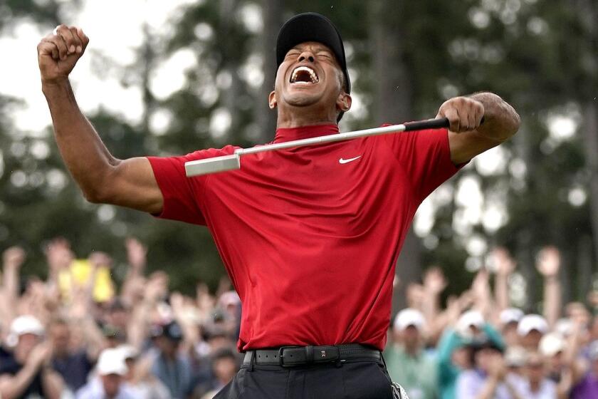 Tiger Woods reacts as he wins the Masters golf tournament Sunday, April 14, 2019, in Augusta, Ga. (AP Photo/David J. Phillip)