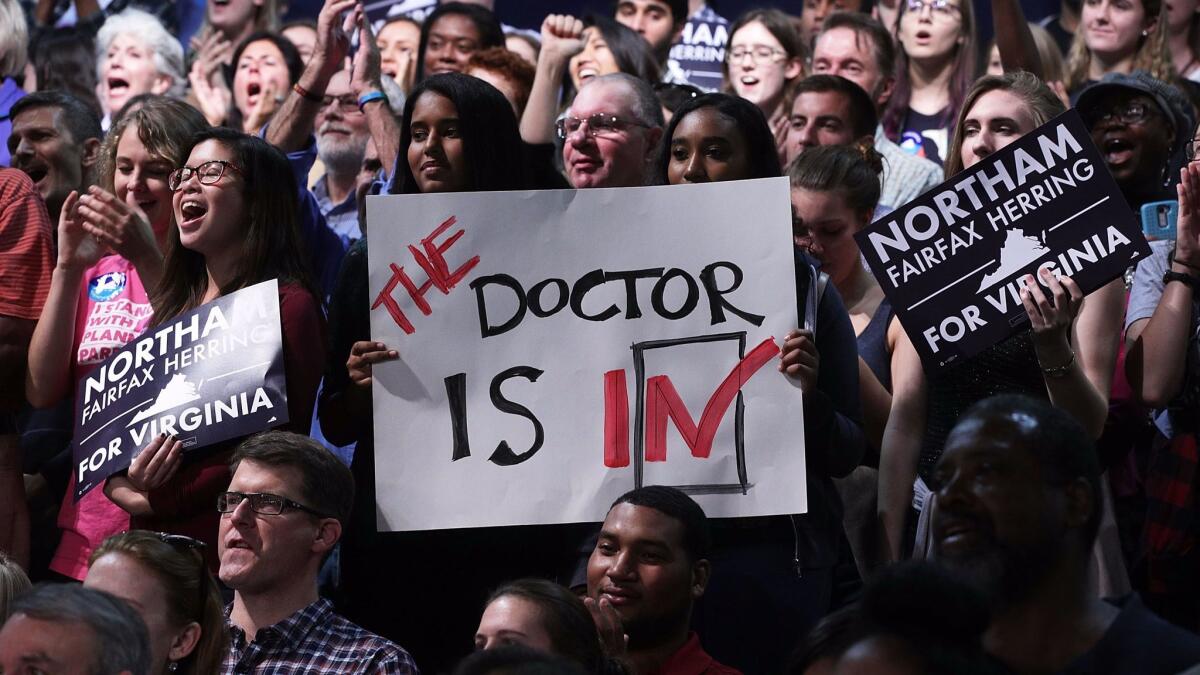 Supporters attend a recent campaign event for Democratic gubernatorial candidate Ralph Northam in Virginia. The state's election has drawn national attention and volunteers.