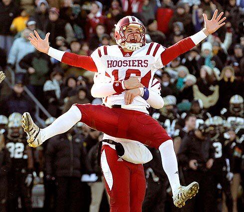 Indiana kicker Mitch Ewald celebrates with holder Teddy Schell after kicking the winning field goal in overtime against Purdue in an NCAA football game in West Lafayette, Ind., on Saturday.
