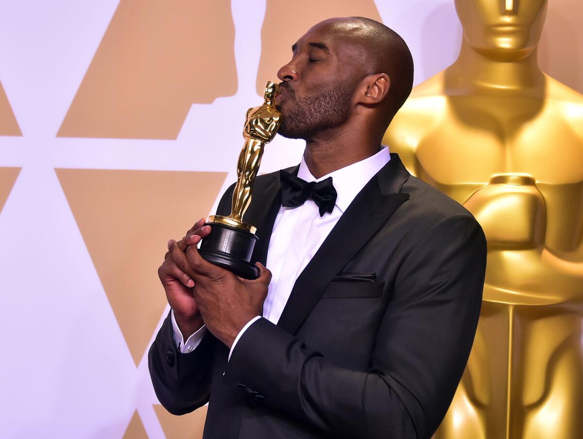 TOPSHOT - Kobe Bryant poses in the press room with the Oscar for Best Animated Short Film for "Dear Basketball," during the 90th Annual Academy Awards on March 4, 2018, in Hollywood, California. (Photo by FREDERIC J. BROWN / AFP) (Photo credit should read FREDERIC J. BROWN/AFP via Getty Images)